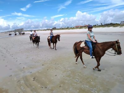 Group beach horse ride on Amelia Island