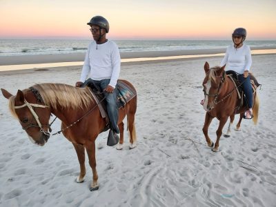 Couple on a sunset horseback ride